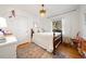 Bright bedroom with hardwood floors and a wooden bed frame at 616 Yale St, Raleigh, NC 27609