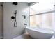 Relaxing bathroom features a freestanding tub and modern shower fixtures at 6358 Pathway Ct Ct, Chapel Hill, NC 27516