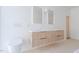 Bathroom featuring a modern vanity with double sinks, designer lighting, and terrazzo flooring at 6358 Pathway Ct Ct, Chapel Hill, NC 27516