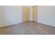 Bright bedroom featuring two light-colored wood closets and neutral walls at 6358 Pathway Ct Ct, Chapel Hill, NC 27516