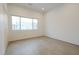 Spacious bedroom with a window letting in natural light and neutral walls at 6358 Pathway Ct Ct, Chapel Hill, NC 27516