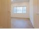 This bedroom features clean, modern design, concrete floors, and views of the yard at 6358 Pathway Ct Ct, Chapel Hill, NC 27516