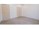 Bright bedroom featuring two light-colored wood closets and neutral walls at 6358 Pathway Ct Ct, Chapel Hill, NC 27516