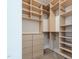Walk-in closet with built-in shelving, hanging rods, and dresser at 6358 Pathway Ct Ct, Chapel Hill, NC 27516