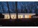 Modern home with many windows surrounded by trees at 6358 Pathway Ct Ct, Chapel Hill, NC 27516