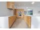 Bright, modern kitchen featuring sleek cabinetry, white countertops, and stainless steel appliances at 6358 Pathway Ct Ct, Chapel Hill, NC 27516