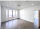 A large, bright living room features concrete floors, recessed lighting and doors to the exterior at 6358 Pathway Ct Ct, Chapel Hill, NC 27516