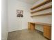 Modern office space with floating shelves, a sleek desk, and minimalist design elements at 6358 Pathway Ct Ct, Chapel Hill, NC 27516