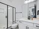 Clean bathroom with white vanity, a walk-in shower, and modern fixtures at 678 The Parks Dr, Pittsboro, NC 27312