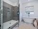 Spa-like bathroom with a large walk-in shower and a soaking tub at 678 The Parks Dr, Pittsboro, NC 27312