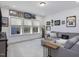 Large bonus room with sectional sofa and plenty of natural light at 678 The Parks Dr, Pittsboro, NC 27312