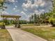 Community with walking path and wooden pergola at 678 The Parks Dr, Pittsboro, NC 27312