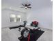 Home gym with rowing machine, weights, and a treadmill at 678 The Parks Dr, Pittsboro, NC 27312