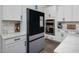Modern kitchen with stainless steel appliances and white cabinetry at 678 The Parks Dr, Pittsboro, NC 27312