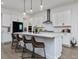 Modern kitchen with white cabinets, quartz countertops, and an island at 678 The Parks Dr, Pittsboro, NC 27312