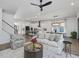 Open living room with hardwood floors and a view into the kitchen at 678 The Parks Dr, Pittsboro, NC 27312