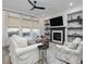 Spacious living room with fireplace, built-in shelving, and hardwood floors at 678 The Parks Dr, Pittsboro, NC 27312