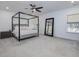 Spacious main bedroom with a large canopy bed, plush carpet, and plenty of natural light at 678 The Parks Dr, Pittsboro, NC 27312