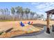 Firepit with seating area in spacious backyard at 70 Kinsale Ct, Fuquay Varina, NC 27526
