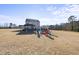 Firepit and seating area overlooking backyard at 70 Kinsale Ct, Fuquay Varina, NC 27526