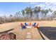 Firepit with seating area in spacious backyard at 70 Kinsale Ct, Fuquay Varina, NC 27526