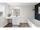 Clean bathroom with a large soaking tub and vanity at 70 Kinsale Ct, Fuquay Varina, NC 27526