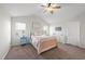 Cozy bedroom with a queen-size bed and ceiling fan at 70 Kinsale Ct, Fuquay Varina, NC 27526
