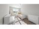 Bright bedroom featuring a twin bed, desk, and mirror at 70 Kinsale Ct, Fuquay Varina, NC 27526