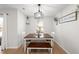 Bright dining area with a table, bench, and four chairs at 70 Kinsale Ct, Fuquay Varina, NC 27526