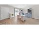 Home office with a desk, built-in shelves, and hardwood floors at 70 Kinsale Ct, Fuquay Varina, NC 27526