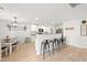 Eat-in kitchen with white cabinets, granite counters, and a farmhouse style at 70 Kinsale Ct, Fuquay Varina, NC 27526