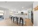 Modern kitchen with white cabinets, granite counters, and black appliances at 70 Kinsale Ct, Fuquay Varina, NC 27526