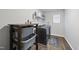 Laundry room with washer, dryer, and storage shelves at 70 Kinsale Ct, Fuquay Varina, NC 27526