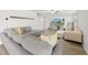 Open living area featuring sectional sofa, large TV, and hardwood floors at 70 Kinsale Ct, Fuquay Varina, NC 27526