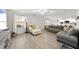 Spacious living room with gray sectional sofa and hardwood floors at 70 Kinsale Ct, Fuquay Varina, NC 27526