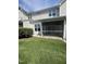 Exterior of the home with a screened-in porch overlooking the green backyard at 7205 Ladbrooke St, Raleigh, NC 27617