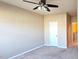 Neutral bedroom with a ceiling fan, plush carpet, and great natural lighting at 7205 Ladbrooke St, Raleigh, NC 27617