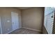 Well-lit bedroom featuring a window, neutral walls, and cozy carpeting for relaxation and comfort at 7205 Ladbrooke St, Raleigh, NC 27617