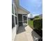 Exterior view of home featuring a screened-in porch and neatly trimmed landscaping at 7205 Ladbrooke St, Raleigh, NC 27617