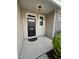 Inviting front porch with stylish black door and matching hardware, offering a warm welcome at 7205 Ladbrooke St, Raleigh, NC 27617