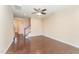 Spacious living room with hardwood floors, staircase, and neutral walls providing a cozy feel at 7205 Ladbrooke St, Raleigh, NC 27617