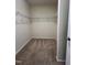 Spacious walk-in closet with carpeted floor and metal shelving, perfect for maximizing storage at 7205 Ladbrooke St, Raleigh, NC 27617