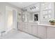 Elegant bathroom with double vanity, ample counter space, and plenty of storage, complemented by bright lighting at 76527 Rice, Chapel Hill, NC 27517