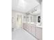 Bathroom featuring double sinks, large mirror, ample cabinet space, with a tile floor at 76527 Rice, Chapel Hill, NC 27517