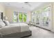 Inviting primary bedroom with backyard views, access to a balcony, and carpeted floors at 76527 Rice, Chapel Hill, NC 27517