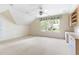Bonus room with lots of built-in storage, neutral carpet, and large window overlooking greenery at 76527 Rice, Chapel Hill, NC 27517