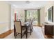 Elegant dining room featuring hardwood floors, a large window, and neutral decor at 76527 Rice, Chapel Hill, NC 27517