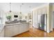 Gourmet kitchen with stainless appliances and granite countertops flows into the living area at 76527 Rice, Chapel Hill, NC 27517