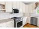 Bright kitchen featuring custom cabinets, stainless steel appliances, and hardwood flooring at 76527 Rice, Chapel Hill, NC 27517