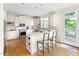 Spacious kitchen with stainless appliances, an island, and white cabinets offer an eat-in area at 76527 Rice, Chapel Hill, NC 27517